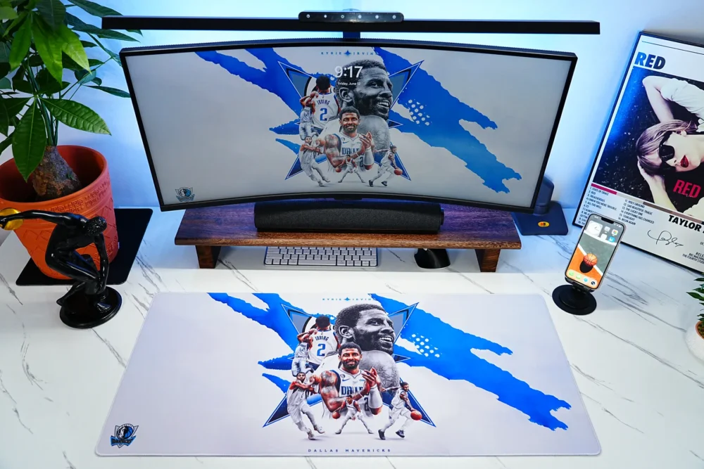 Kyrie Irving Mavericks Desk Setup Mat Kyrie Irving Dallas Mavericks Desk Mat shown with matching monitor wallpaper, giving fans a unified basketball desk setup for work and gaming