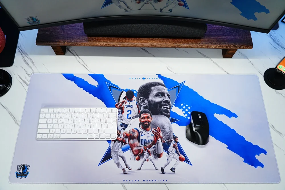 Mavericks Desk Mat for Keyboard and Mouse Mavericks desk mat shown with keyboard and mouse, giving users one wide surface for typing, mouse movement, and basketball artwork