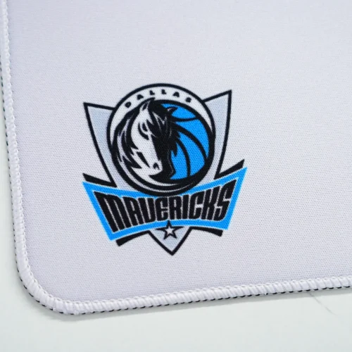 Dallas Mavericks Stitched Edge Desk Mat Dallas Mavericks logo and stitched edge detail on the desk mat, showing reinforced borders that help reduce fraying and fabric lift