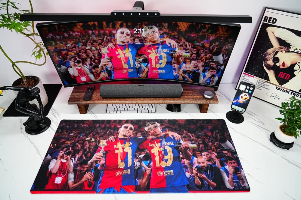 Lamine Yamal Barcelona Mouse Pad covering the desk with a full Barcelona celebration scene that unifies the monitor and desktop space
