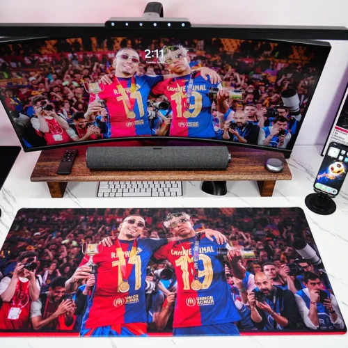 Lamine Yamal Barcelona Mouse Pad covering the desk with a full Barcelona celebration scene that unifies the monitor and desktop space