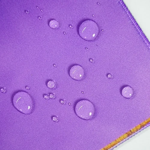 Spill-Resistant LeBron Desk Mat Surface Spill-resistant LeBron desk mat surface with water beads staying on top to protect the artwork during daily use
