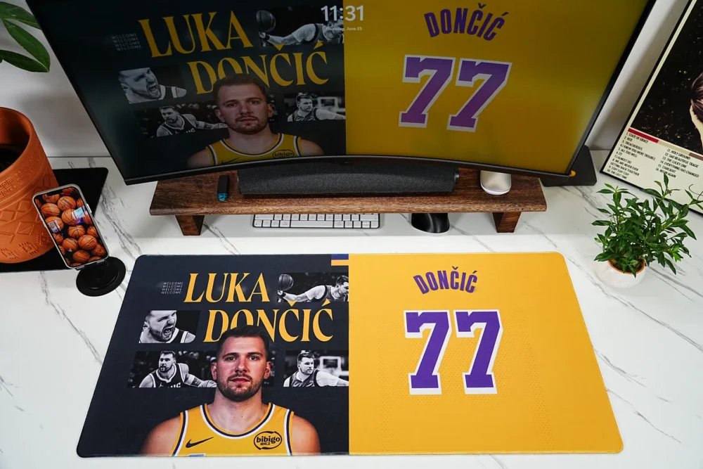Luka Doncic Lakers 77 desk pad shown in a complete gaming setup with matching monitor artwork and basketball desk decor