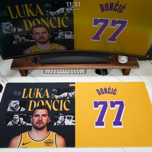 Luka Doncic Lakers 77 desk pad shown in a complete gaming setup with matching monitor artwork and basketball desk decor