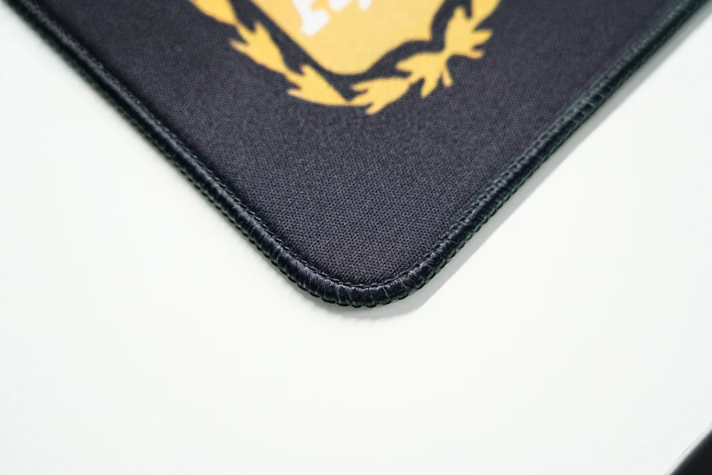 Messi Mouse Pad Stitched Edge Detail Close-up of stitched edge and rounded corner on Messi mouse pad designed to reduce fraying and fabric separation