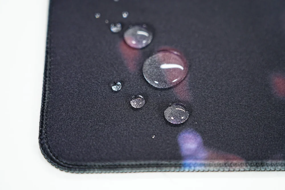 Jordan Bulls Spill Resistant Desk Mat Surface Water beads on the Jordan Bulls desk mat surface show spill-resistant fabric that protects daily use