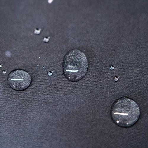 Neymar Jr Soccer Tribute Mouse Pad surface with water droplets beading on the fabric to show the spill-resistant finish