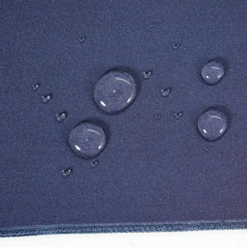 Water-resistant basketball mouse pad surface with water beads staying on top for easier spill cleanup