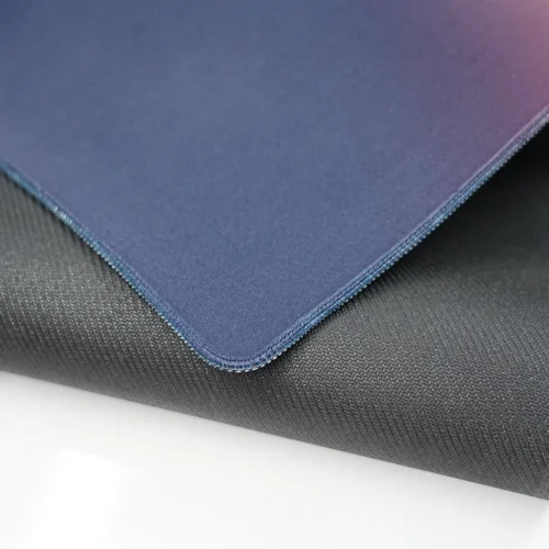 Bent gaming mouse pad showing 4mm rubber base, anti-slip texture, stitched edge, and flexible construction