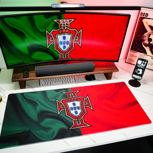 Portugal football desk mat shown in a red green fan setup with matching screen artwork and a World Cup trophy decor for a unified desktop
