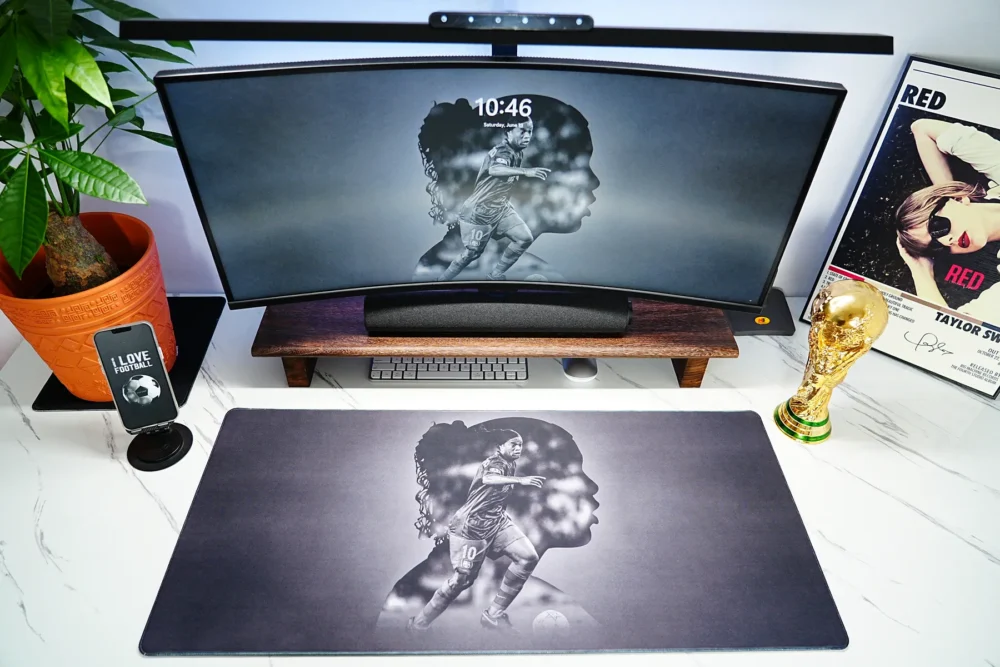 Ronaldinho Barcelona Football Desk Mat shown in a full football desk setup with matching screen artwork and World Cup trophy decor
