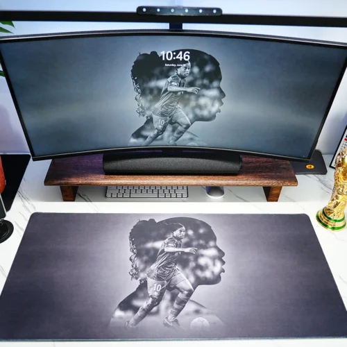 Ronaldinho Barcelona Football Desk Mat shown in a full football desk setup with matching screen artwork and World Cup trophy decor