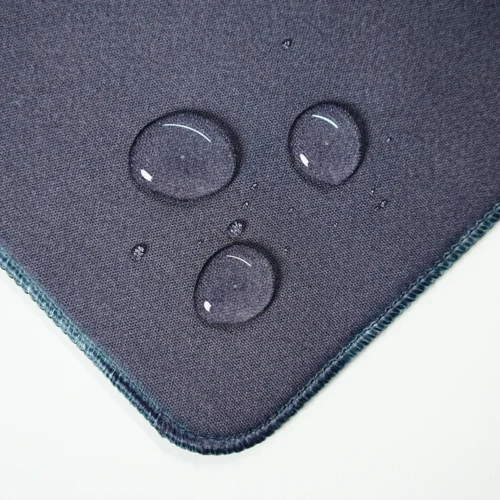 Ronaldinho Barcelona desk mat surface with water droplets staying on top, showing spill-resistant fabric for safer daily use