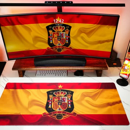 Spain Football Team Desk Mat shown in a coordinated football desk setup with matching screen artwork, World Cup trophy, and daily workspace layout