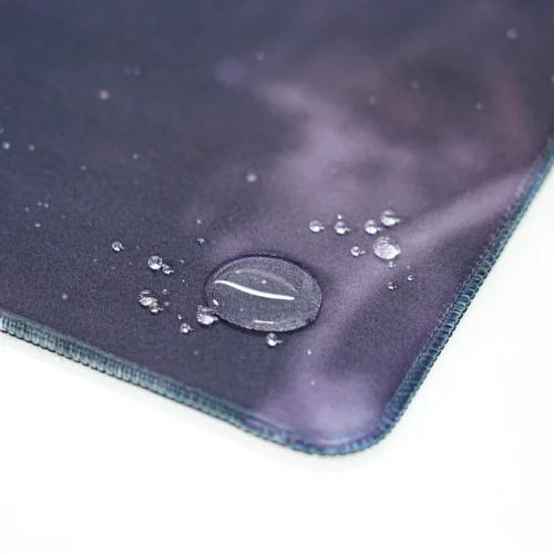 Water droplets stay on basketball mouse pad fabric, showing protection against water and drink soaking