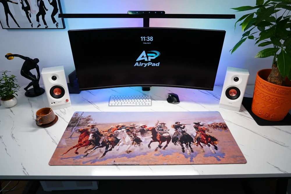 A Dash for the Timber western art desk mat in a desktop setup with keyboard and mouse