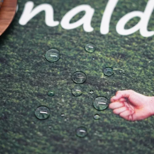Water droplets beading on the Cristiano Ronaldo mouse pad fabric to demonstrate its spill-resistant surface