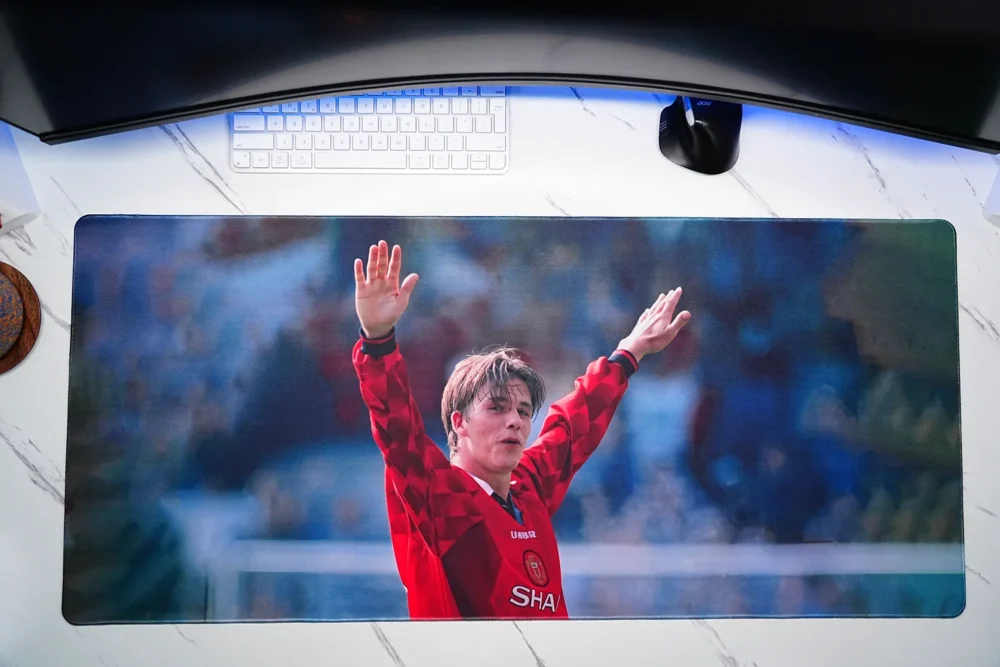 Top-down view of the David Beckham football desk mat showing the full printed surface and stitched border