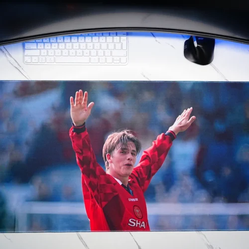 Top-down view of the David Beckham football desk mat showing the full printed surface and stitched border