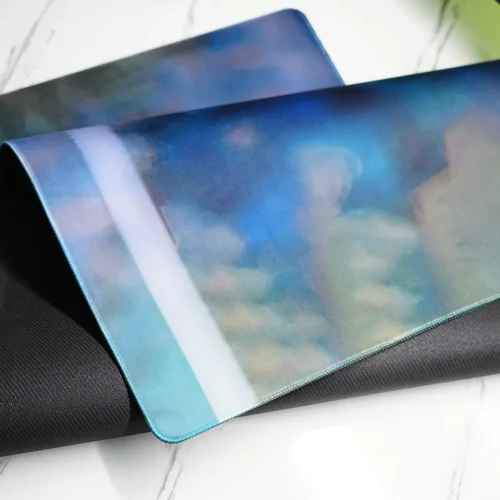 Folded David Beckham desk mat showing the flexible natural rubber base and reinforced stitched edge