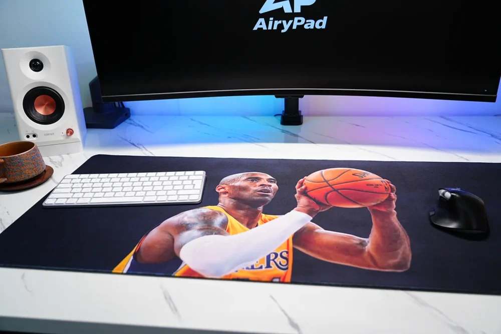 Kobe Bryant Lakers basketball desk mat with a keyboard and mouse setup