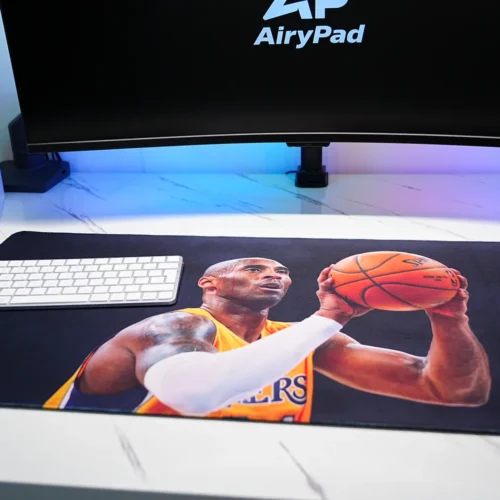 Kobe Bryant Lakers basketball desk mat with a keyboard and mouse setup