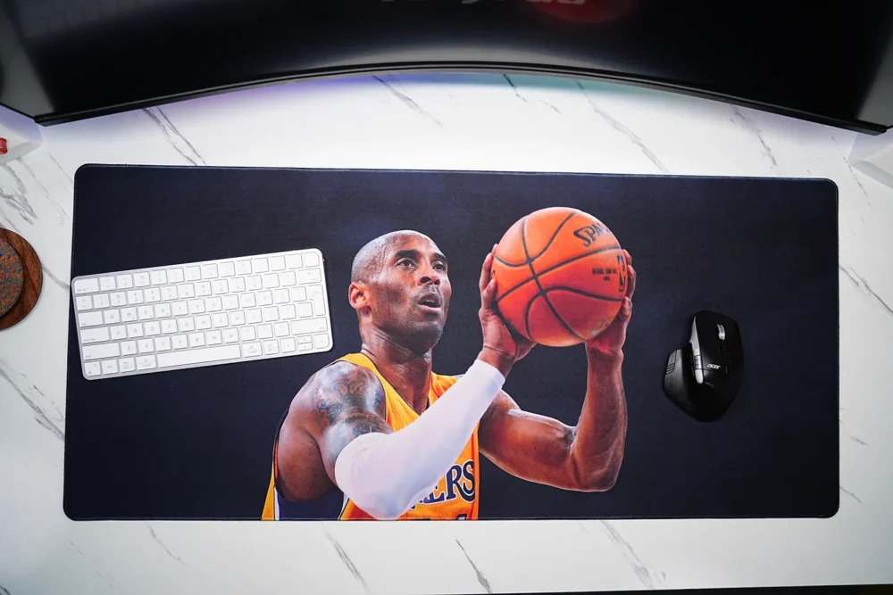 Top-down view of a Kobe Bryant Lakers desk mat with keyboard and mouse