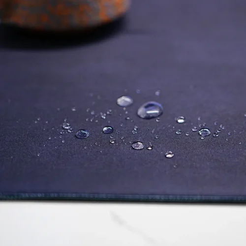 Water droplets on the spill-resistant surface of a Kobe Bryant Lakers desk mat