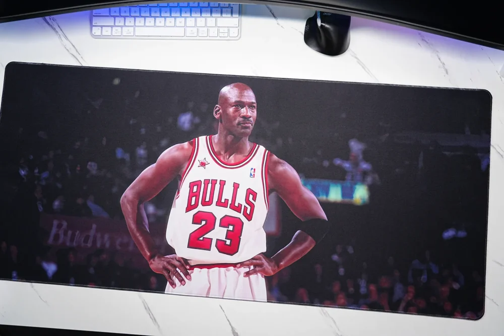 Angled desktop view of a Michael Jordan Chicago Bulls desk mat with keyboard and mouse