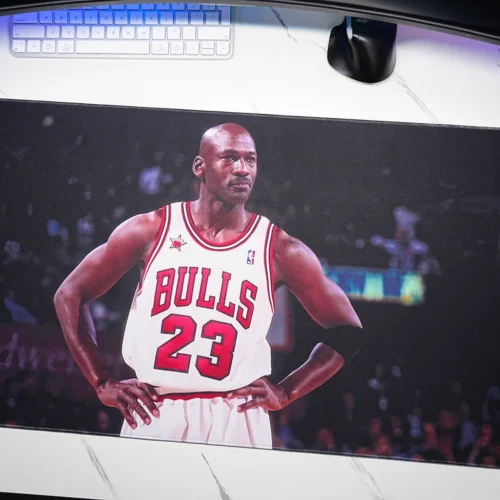 Angled desktop view of a Michael Jordan Chicago Bulls desk mat with keyboard and mouse