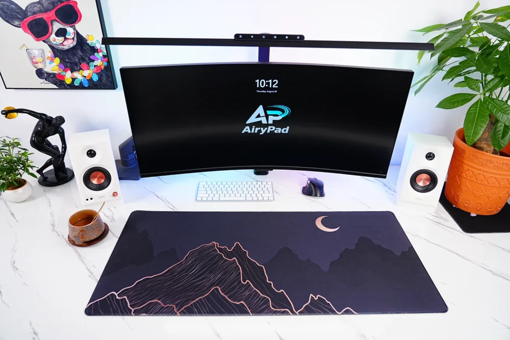 Crescent Moon Mountain desk mat in a full workstation setup with keyboard and mouse