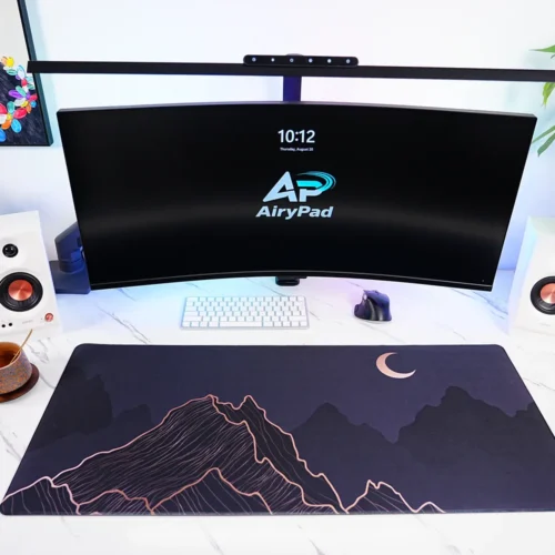 Crescent Moon Mountain desk mat in a full workstation setup with keyboard and mouse