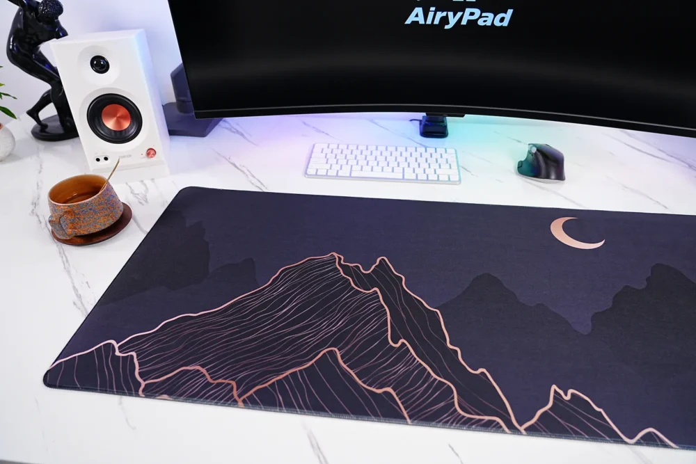 Close-up of Crescent Moon Mountain desk mat showing mountain line art detail