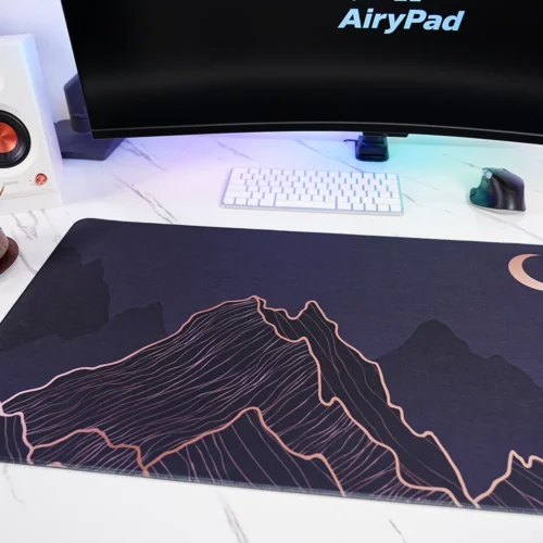 Close-up of Crescent Moon Mountain desk mat showing mountain line art detail