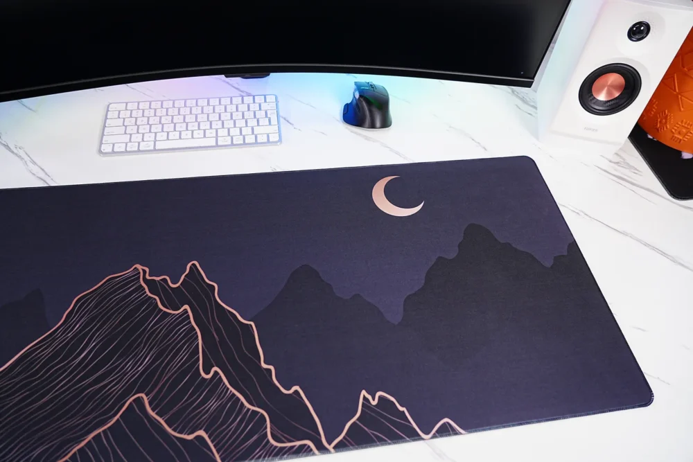 Close-up of Crescent Moon Mountain mouse pad showing rose gold crescent moon artwork