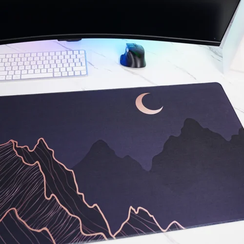 Close-up of Crescent Moon Mountain mouse pad showing rose gold crescent moon artwork