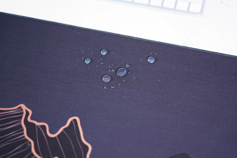 Crescent Moon Mountain mouse pad close-up showing spill-resistant fabric surface