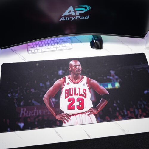 Michael Jordan Chicago Bulls desk mat in a desktop setup with monitor, keyboard, mouse and speakers