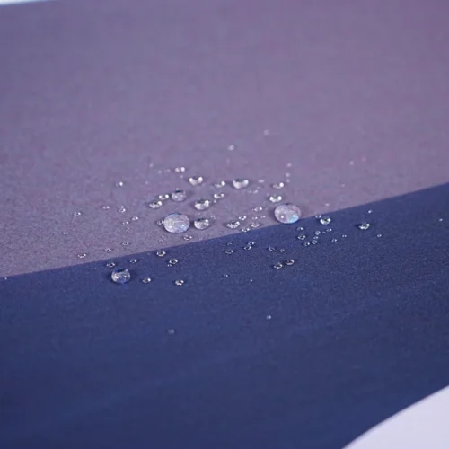 Orange Moon Desert Walker mouse pad close-up showing stitched edge and black rubber base