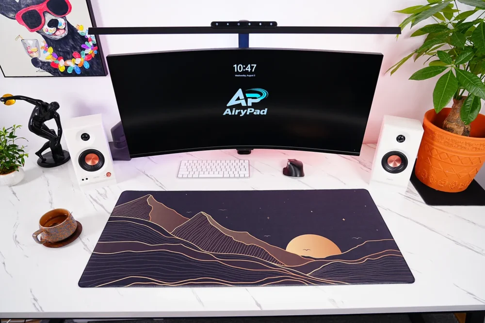 Starry Mountain Sunset desk mat in a full workstation setup with keyboard and mouse
