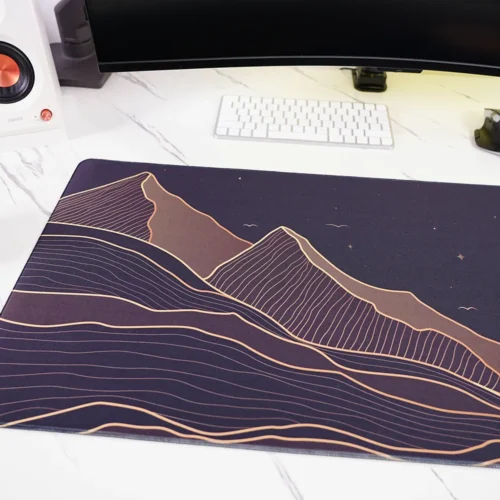 Close-up of Starry Mountain Sunset desk mat showing mountain landscape artwork detail
