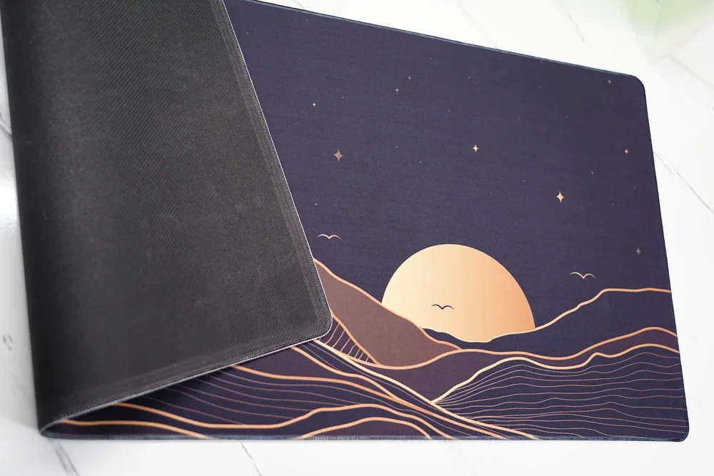 Starry Mountain Sunset mouse pad close-up showing stitched edge and rubber base