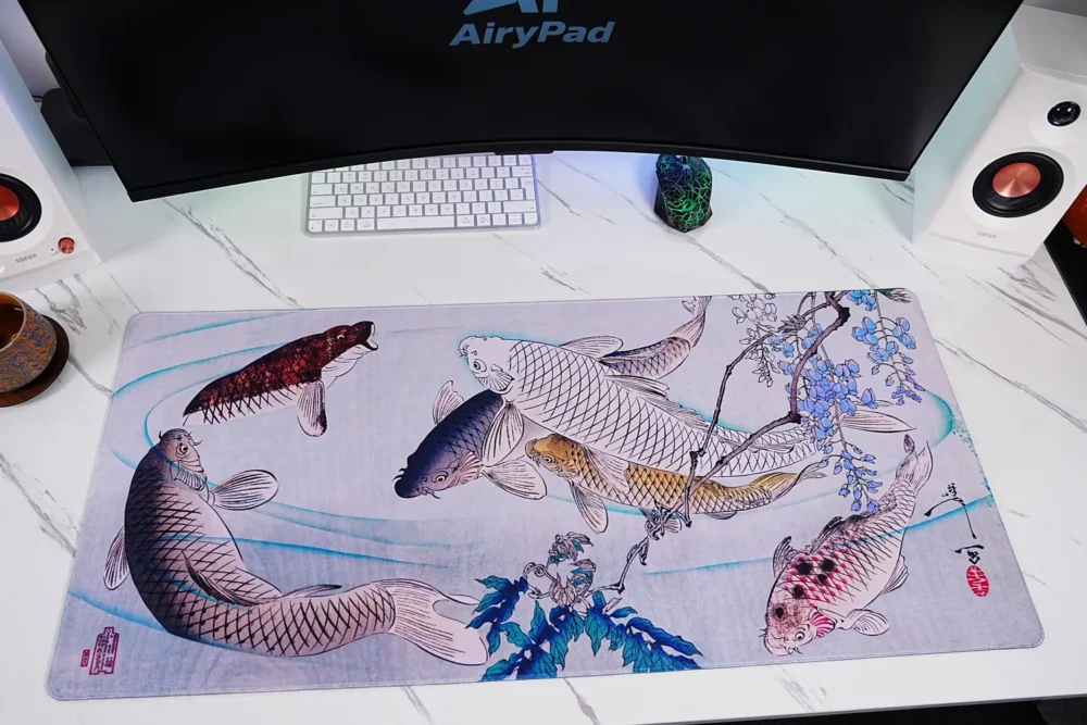 Wisteria Koi Fish Desk Mat with Keyboard and Mouse Wisteria koi fish desk mat shown under keyboard and mouse in a workspace setup